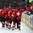 ZUG, SWITZERLAND - APRIL 17: Switzerland's August Impose #11 celebrates at the bench with teammates after the Suisse tied their preliminary round game against Finland at 2015 IIHF Ice Hockey U18 World Championship. (Photo by Francois Laplante/HHOF-IIHF Images)